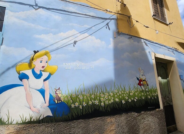 A mural of Alice in Wonderland characters on a building wall. 3