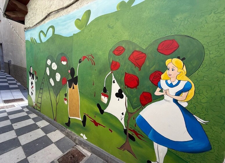A mural of Alice in Wonderland characters on a wall. 4