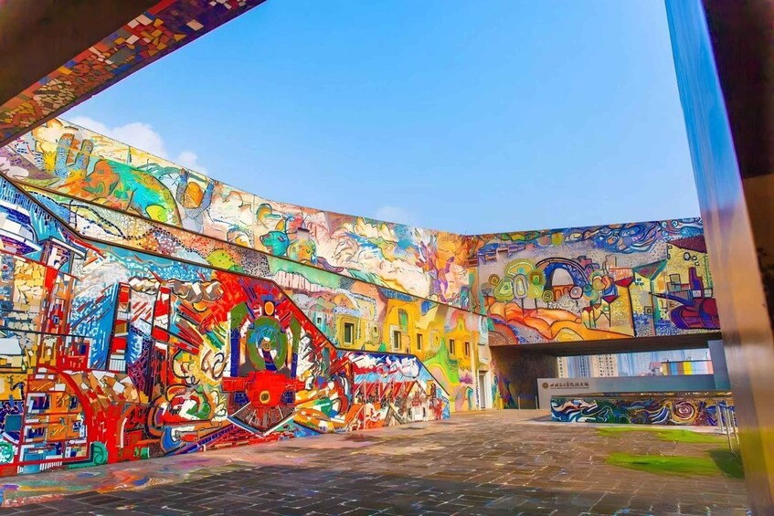 A vibrant mural with abstract and colorful patterns on a building's exterior. 3