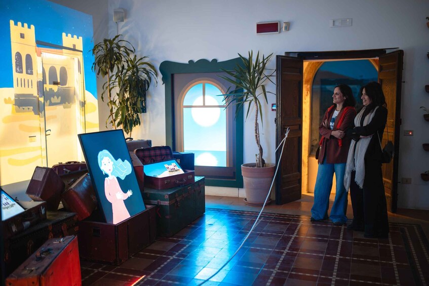 A room with a large painting, several suitcases, and a potted plant. 5