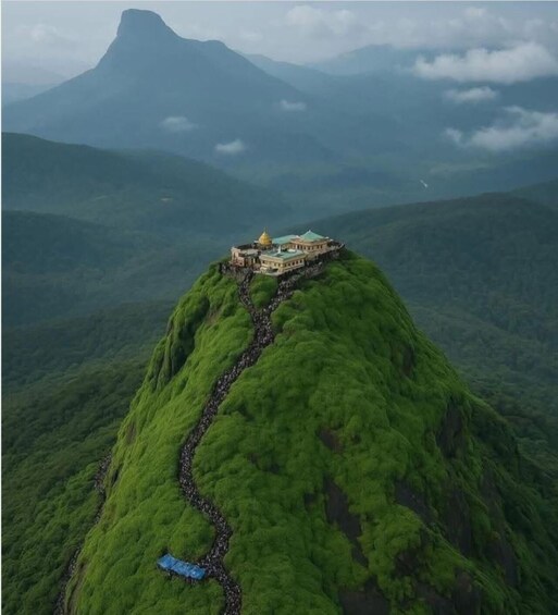 A building on a green hill with a winding path leading to it. 5