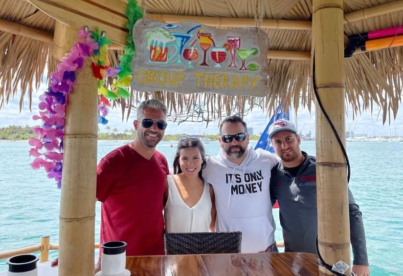 A group therapy session on a boat with a thatched roof and a signboard. 4