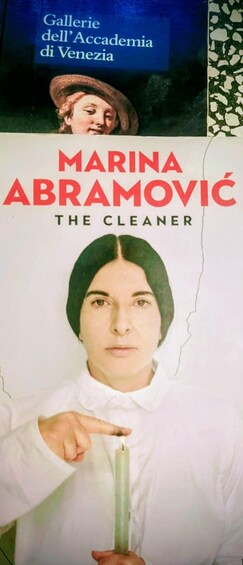 A book cover with the title 'MARINA ABRAMOVIC THE CLEANER' and a person pointing at a green object. 2