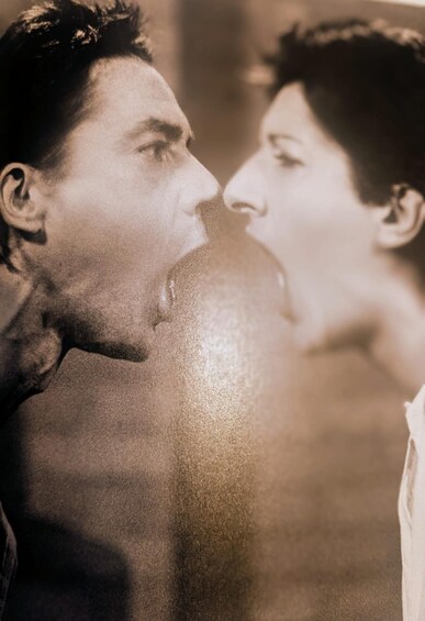 A sepia-toned portrait of two people in close proximity. 5