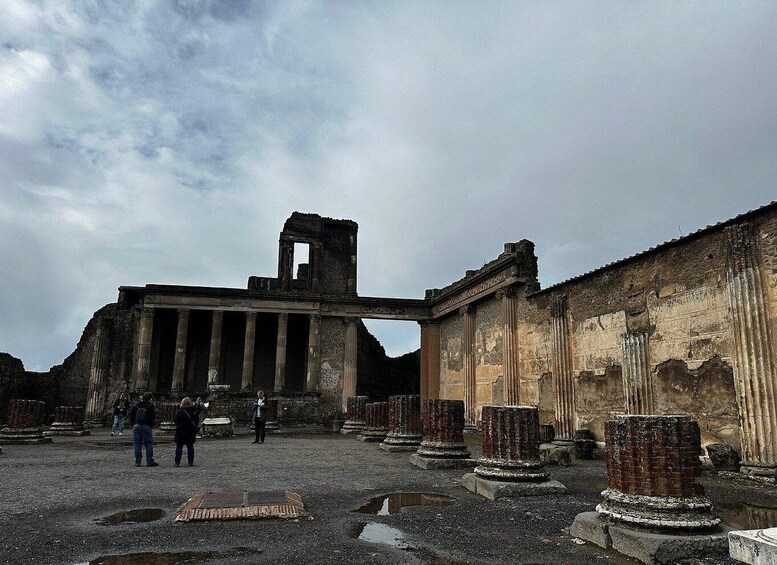Ancient ruins with columns and a partially intact structure. 3