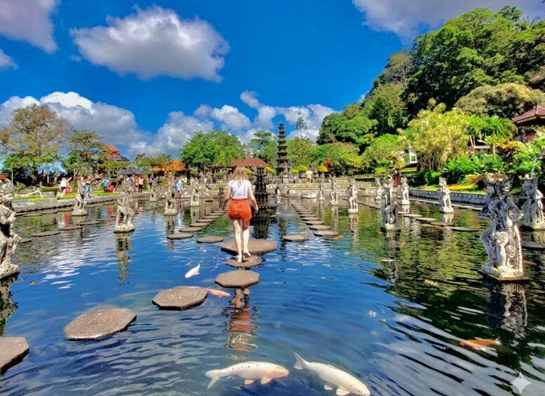 A serene water garden with stone bridges, koi fish, and statues. 2