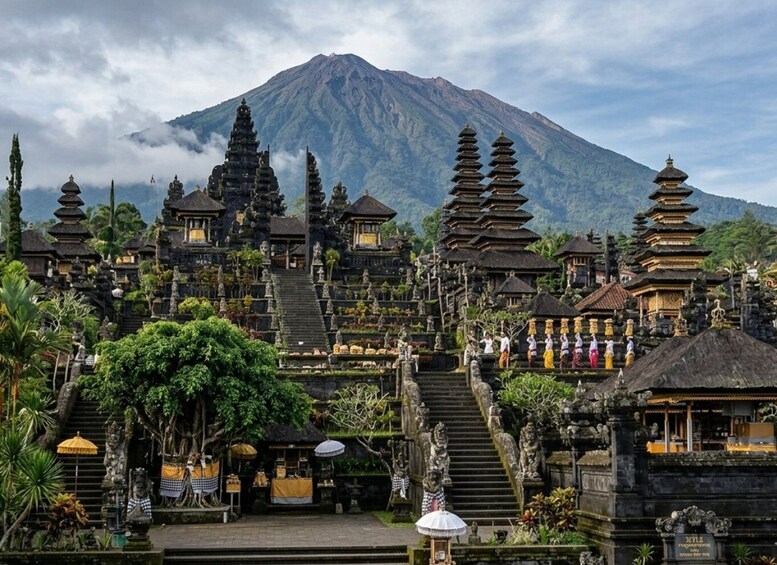 A temple complex with tiered structures and a mountain in the background. 4