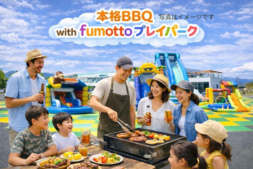 A group of people grilling outdoors with a slide and inflatable play structures in the background. 1