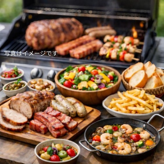 A barbecue with grilled meats, vegetables, and a variety of side dishes. 2
