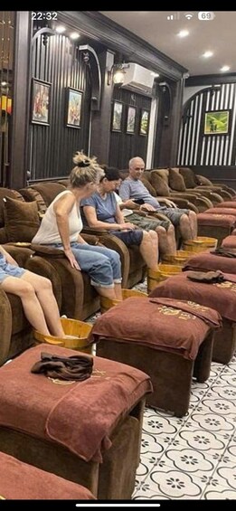 A massage parlor with multiple massage tables and foot baths. 2