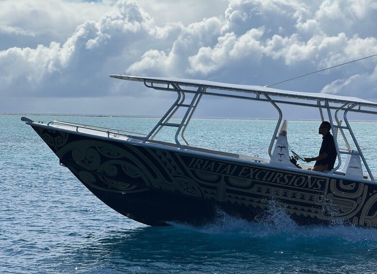 A boat with intricate designs on its side, labeled 'IRATAI EXCURSIONS,' sailing on calm blue waters. 4