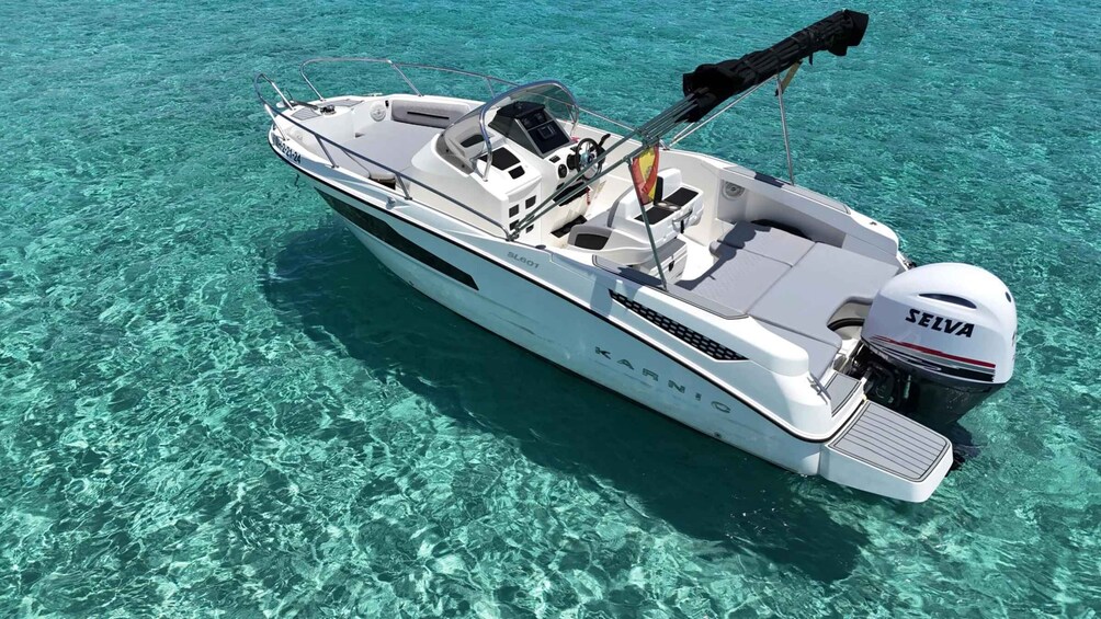 A white motorboat with a 'SELVA' outboard motor, 'KAR' branding, and a 'GL801' model number, floating on clear turquoise water. 3