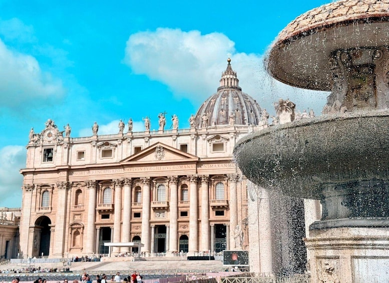 St. Peter's Basilica with a fountain in the foreground. 1