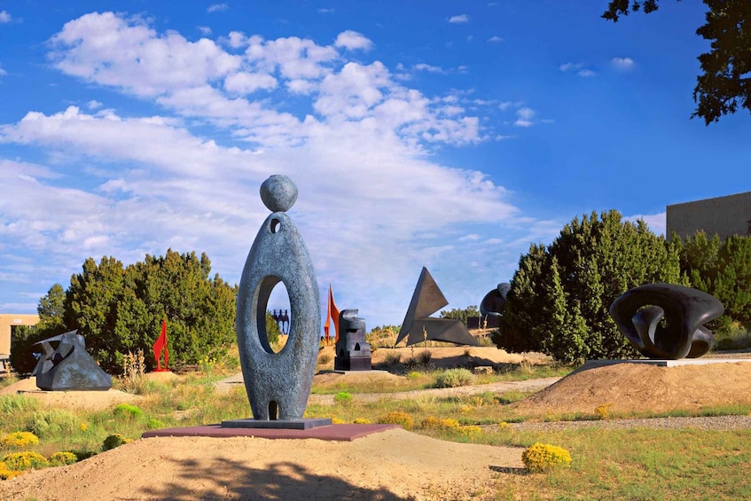 Abstract sculptures in an outdoor setting with a clear sky. 3