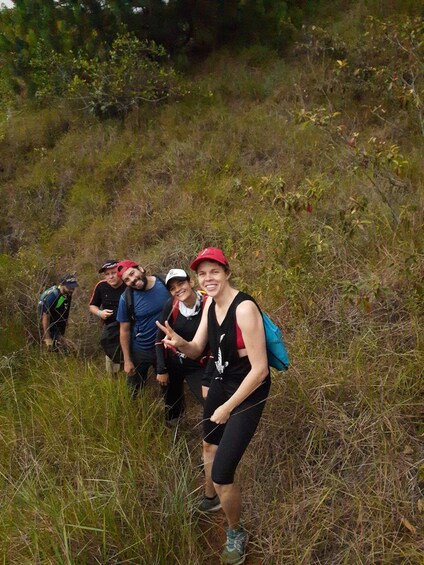A group of hikers on a grassy hillside. 2