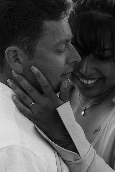 A person wearing a ring and a necklace. 5