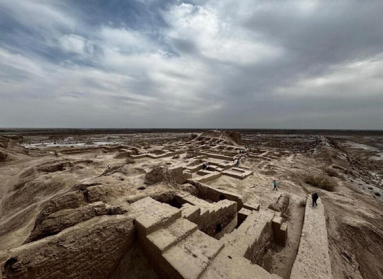 Ancient ruins with stepped structures and a vast, open landscape. 1
