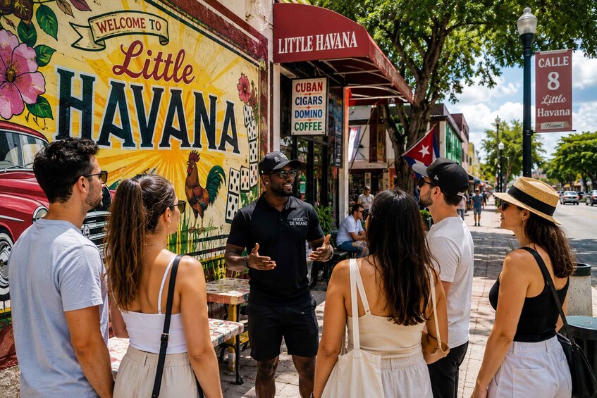Una scena di strada con un furgone gastronomico chiamato 'Little Havana' e un cartello per 'Cuban Cigars Domino Coffee'. 1