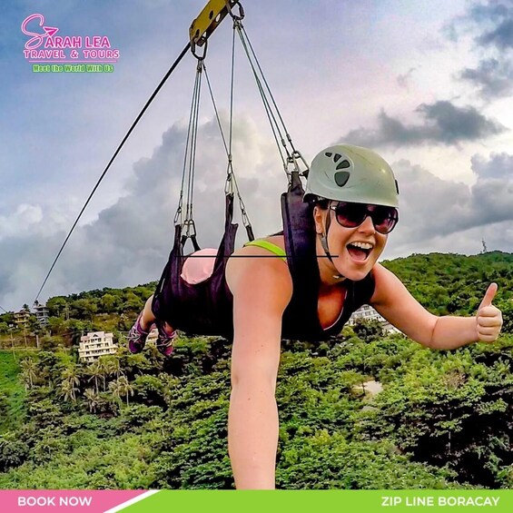 A person suspended in a harness, giving a thumbs-up, with a mountainous landscape in the background. 3