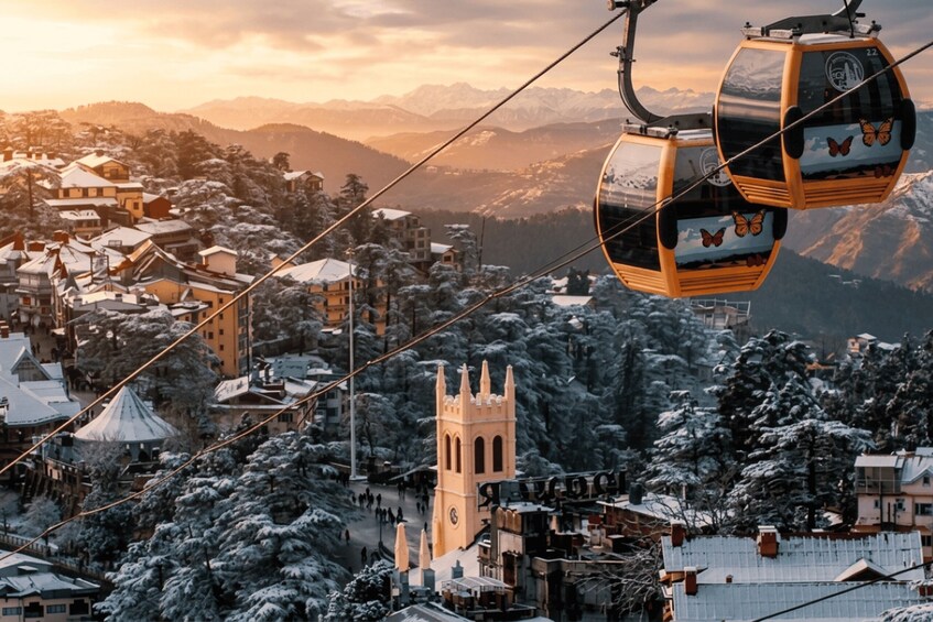 A snow-covered village with a church tower, houses, and a cable car system. 5