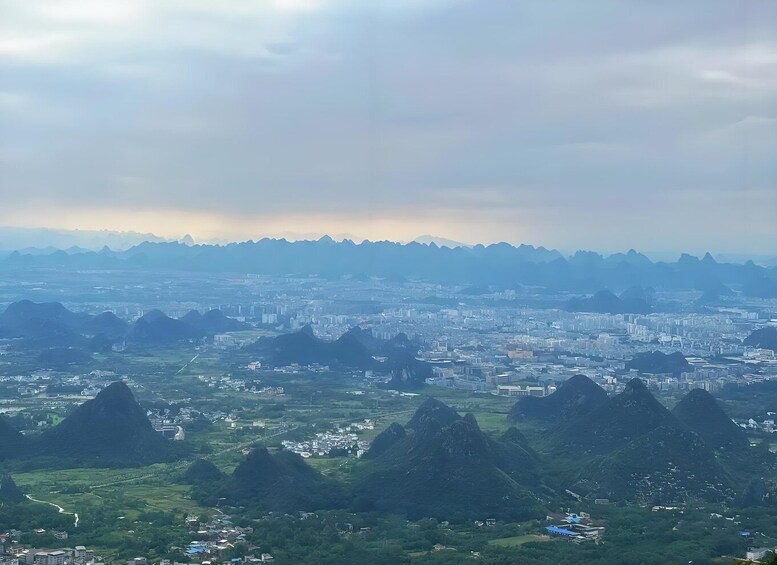A cityscape with a mountainous backdrop. 5