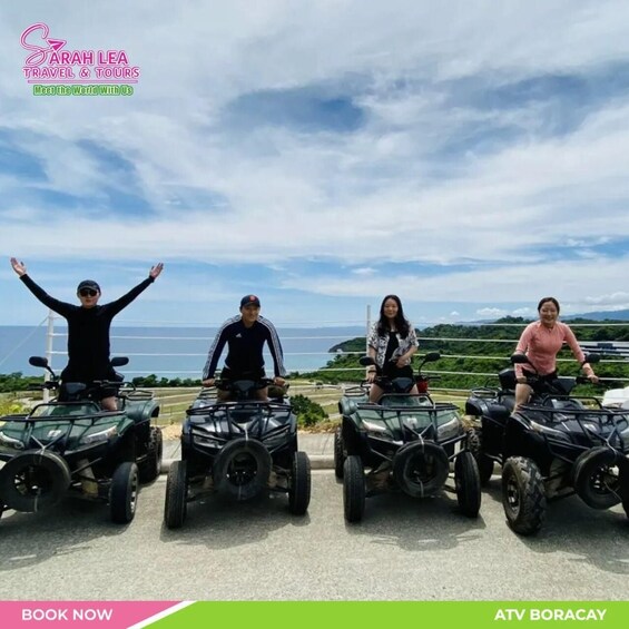 Four people on ATVs with a coastal landscape in the background. 1
