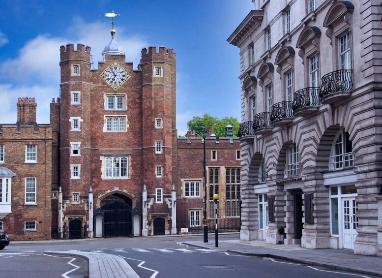 A historic building with a clock tower and a modern structure with ornate balconies. 1