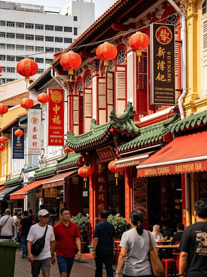 A street lined with traditional Chinese architecture, red lanterns, and signs for restaurants and businesses. 2