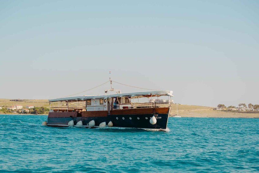 A boat on a calm sea with a clear sky. 5