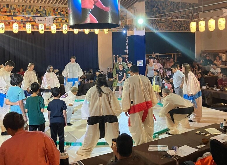 A martial arts demonstration with participants in traditional attire. 4
