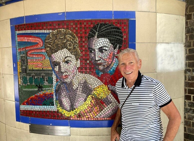 A mosaic mural with a person and a building. 4