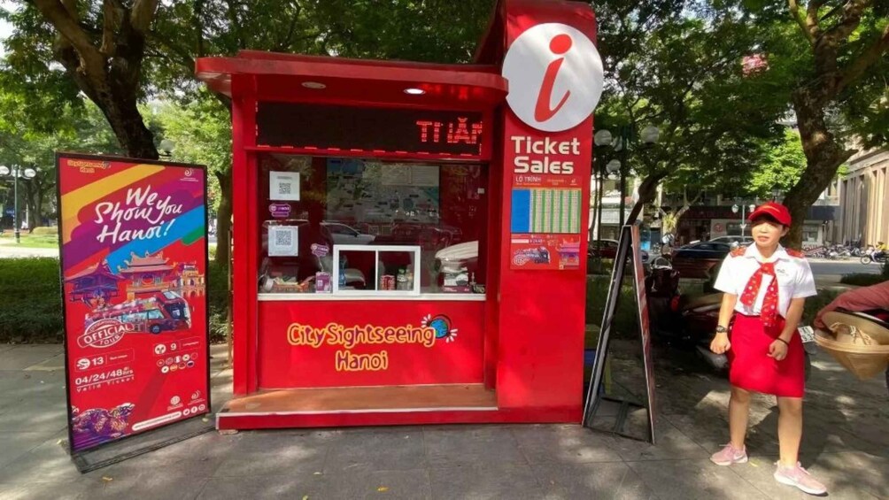 A red ticket sales booth with a sign for CitySightseeing Hanoi. 3
