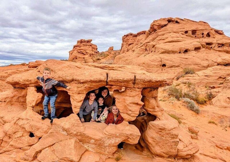 A group of people inside a natural rock formation. 5