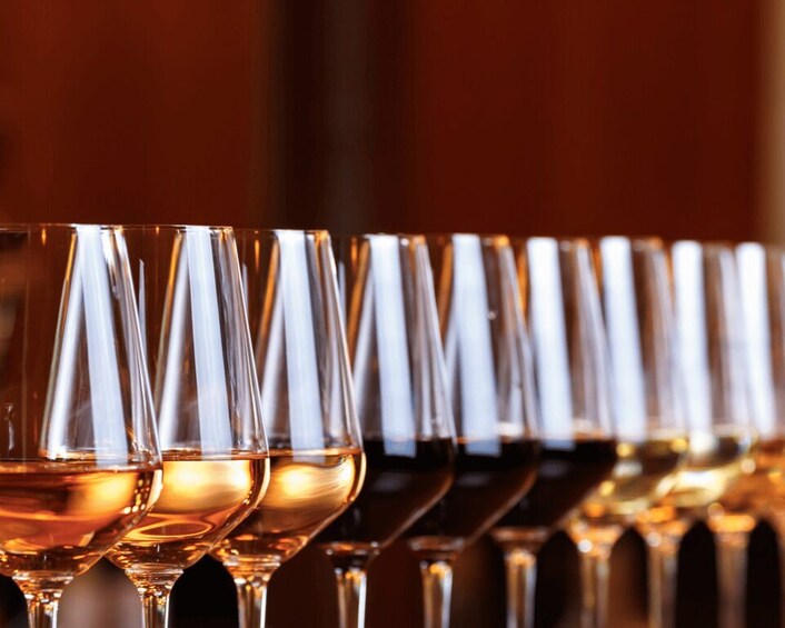 A row of empty wine glasses. 1
