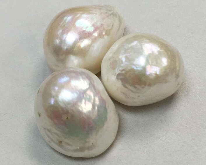 Three polished, spherical objects with a reflective surface. 2