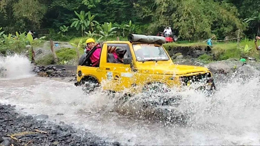 A yellow vehicle navigating through a turbulent river. 1