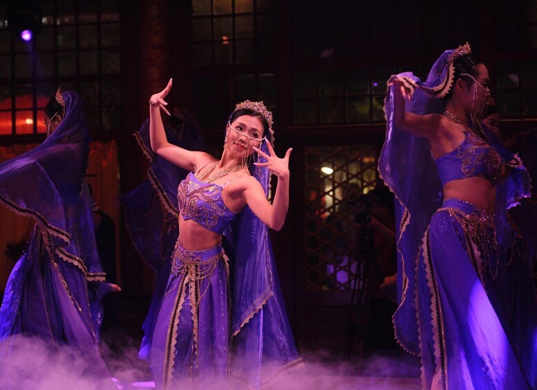 A dance performance with performers in elaborate costumes. 2