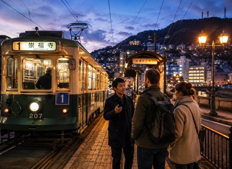 A tram with the number 1 and the destination 'Sozukujima' at a station. 3