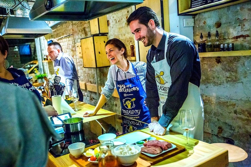 A chef preparing food in a rustic kitchen with wooden shelves and a brick wall. 5