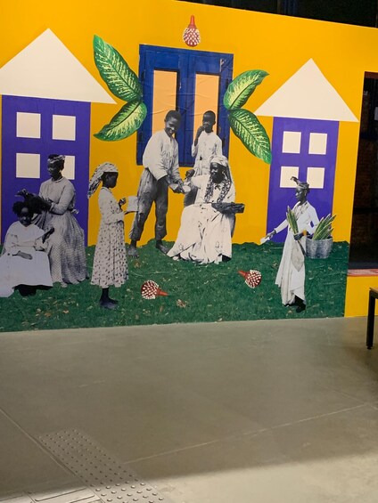 A mural with figures in traditional attire, a blue door, and green leaves. 1