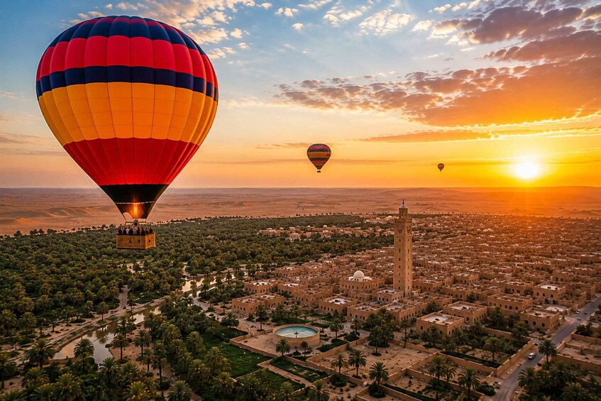 Hot air balloons over a city with a prominent tower and palm trees. 2