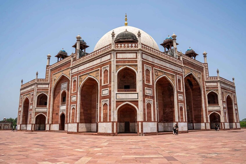 A large, ornate building with a central dome and four minarets. 5