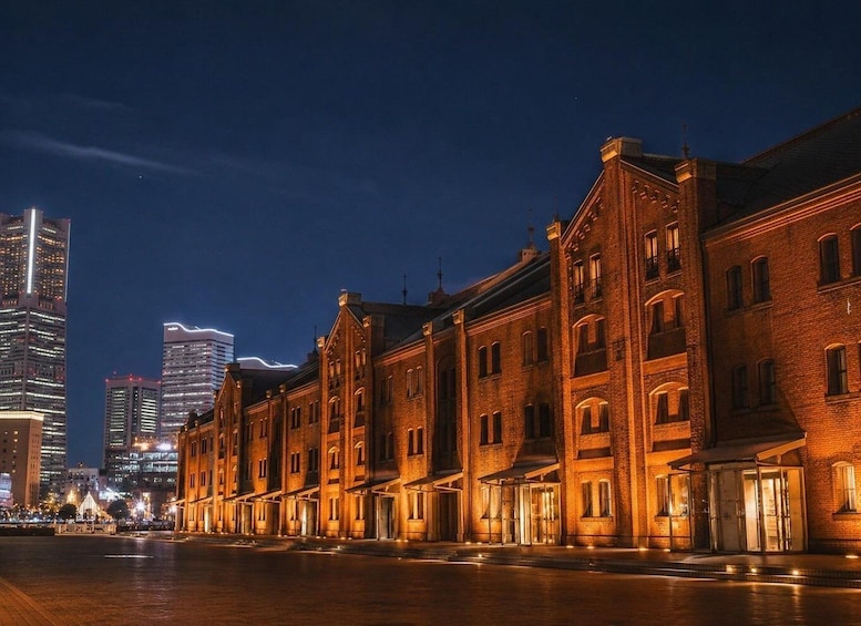 A nighttime cityscape with illuminated historic buildings and modern skyscrapers. 5