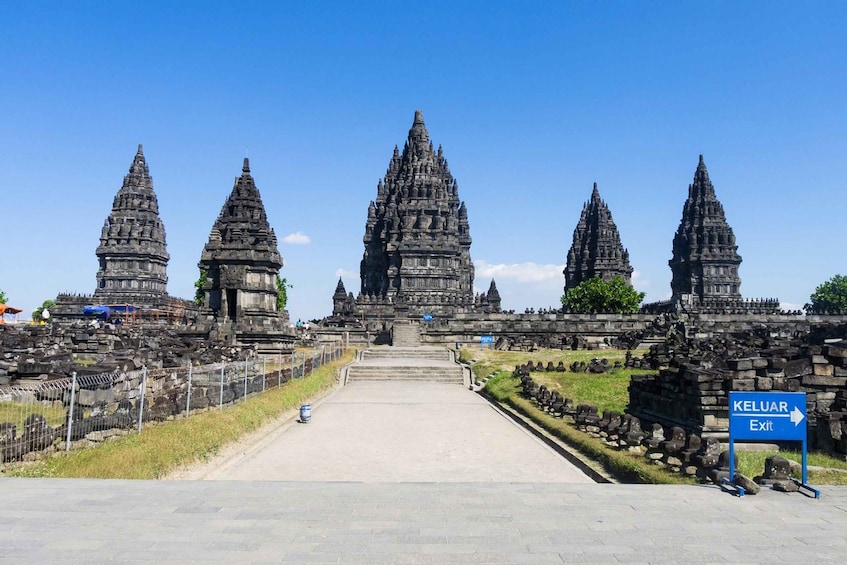 A temple complex with multiple tiered towers and a clear sky. 5