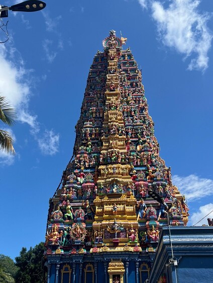 A colorful temple with intricate carvings and statues. 2