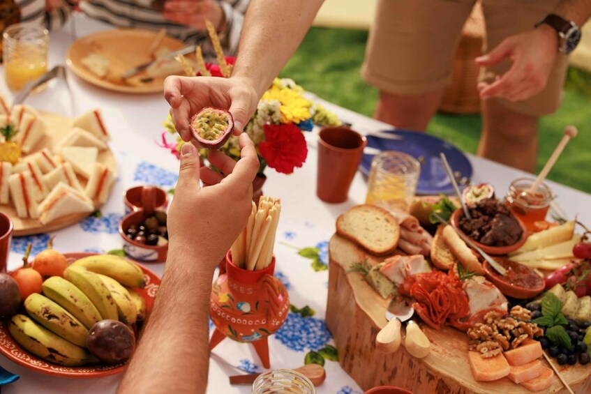 A table with various foods, including bread, cheese, and fruits. 1