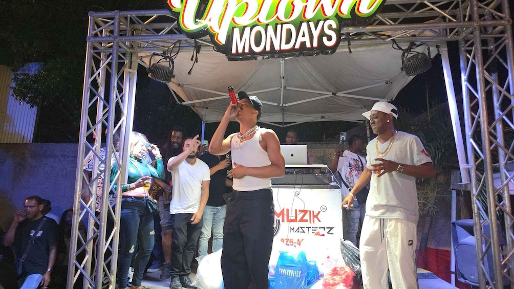 A stage with a sign reading 'Upfront Mondays' and a logo for 'MUZIK MASTEZZ.' 1
