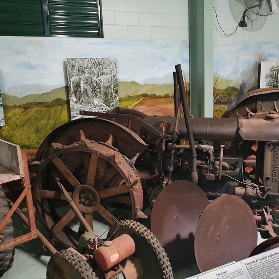 An old tractor with large wheels and a long exhaust pipe. 4