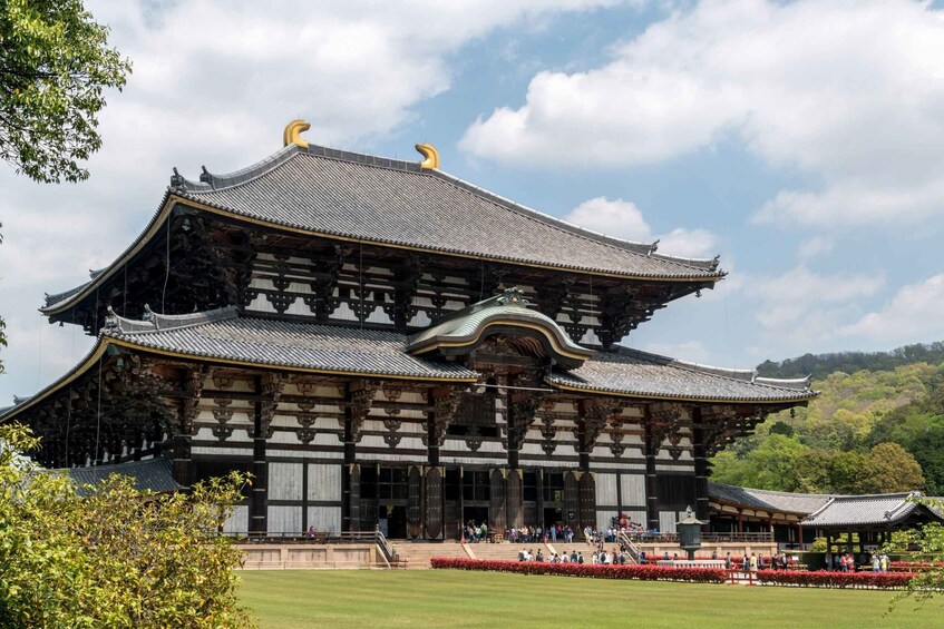 A traditional Japanese building with a curved roof and wooden structure. 1