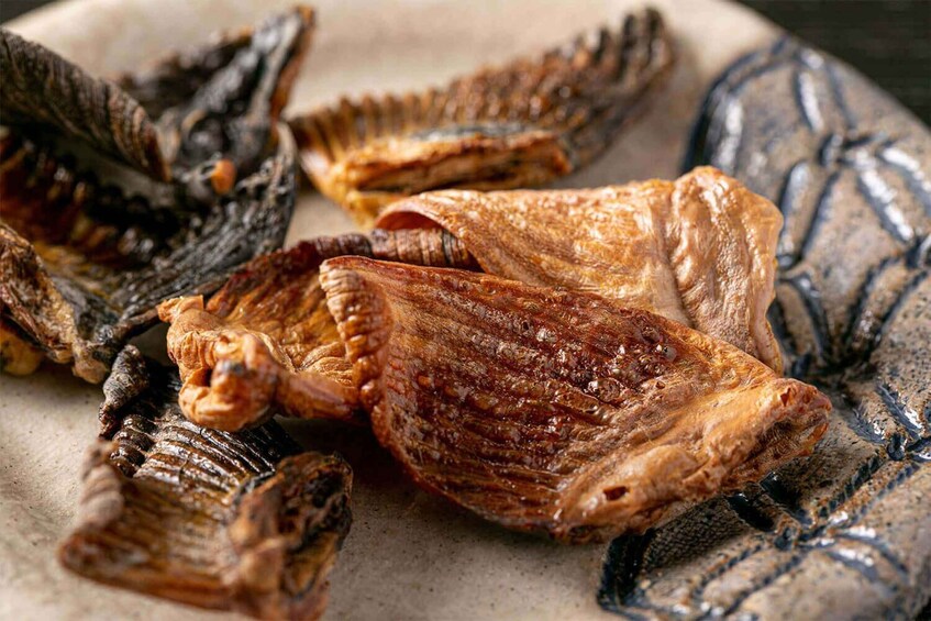 Dried fish on a ceramic plate. 4